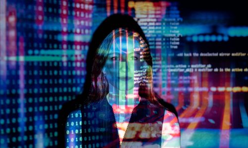 pexels-photo-3861969-3861969 A woman with digital code projections on her face, representing technology and future concepts.